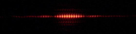 The diffracted pattern of light on a photographic plate